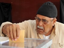 A man casts his vote at a polling station in Sale.