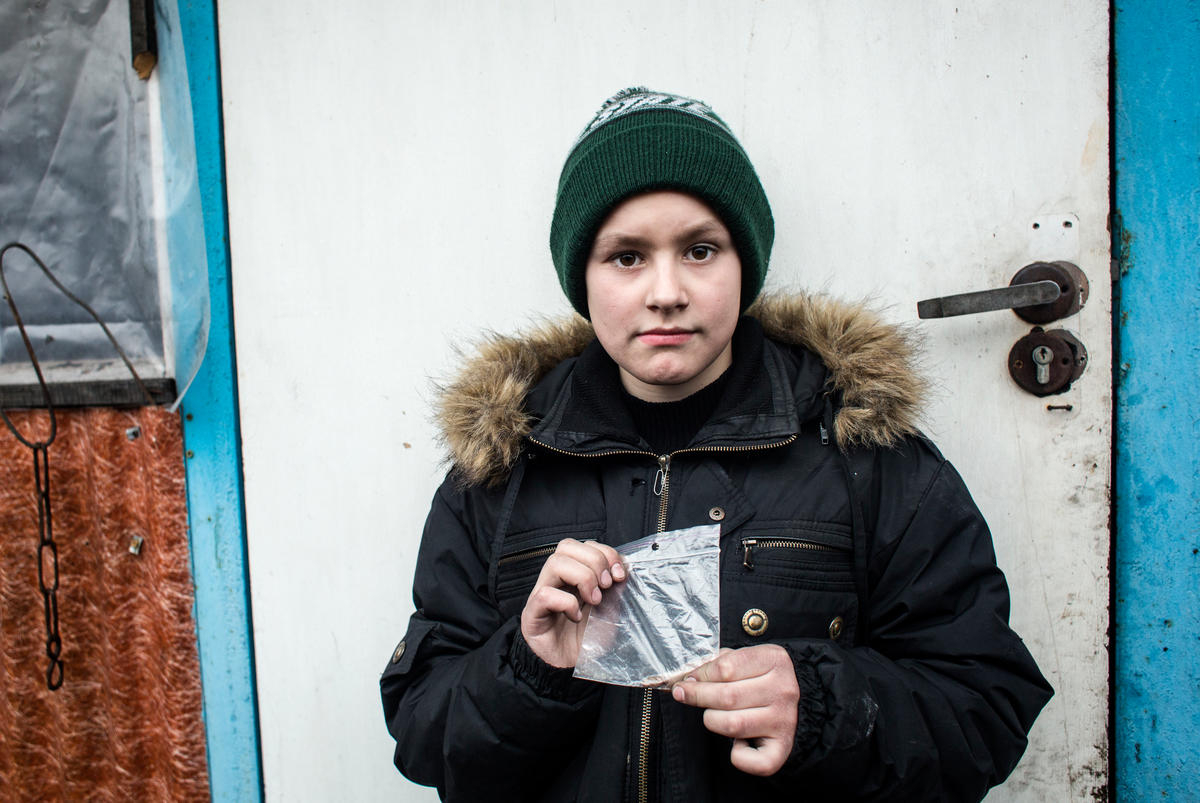 Ukraine. Freedom of movement. Yulia and her son Misha live in a restricted area of Mariinka to where access is very limited.