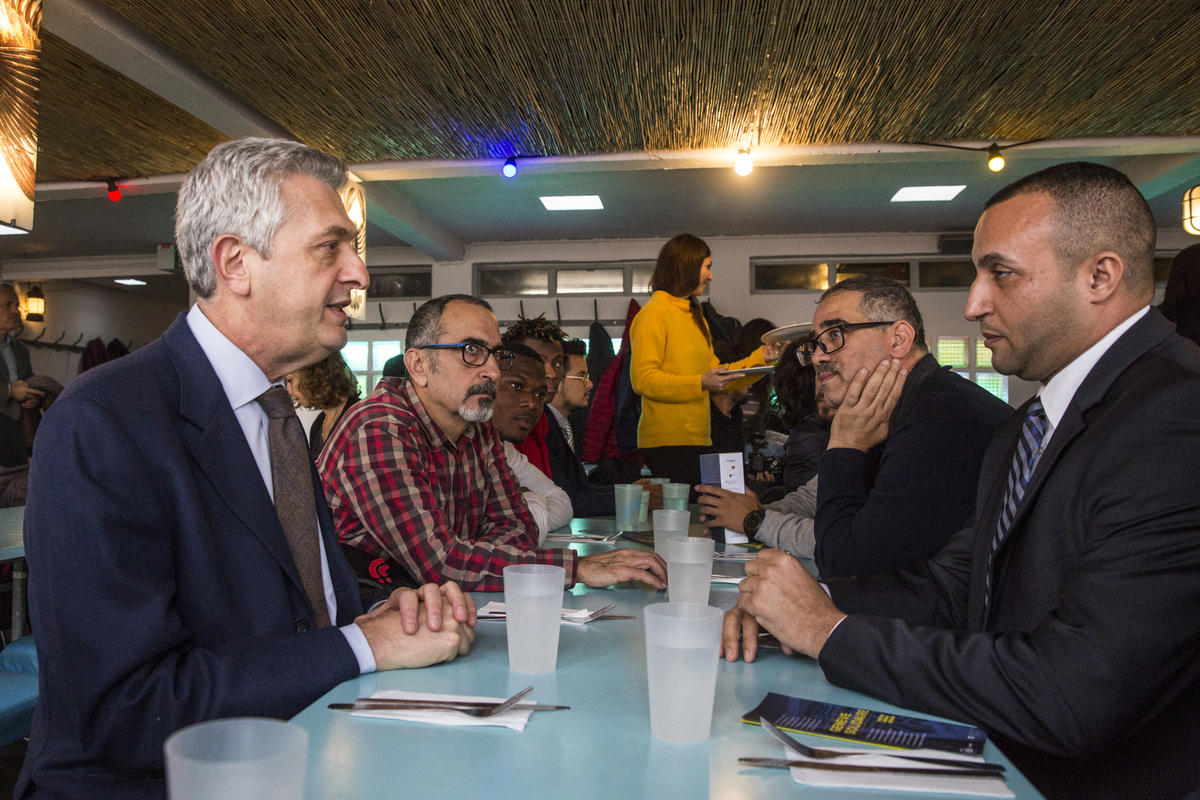 Switzerland. Geneva's lakefront restaurant lays on lunch for a group of refugees