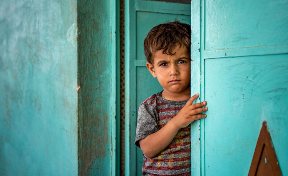 A boy in a doorway