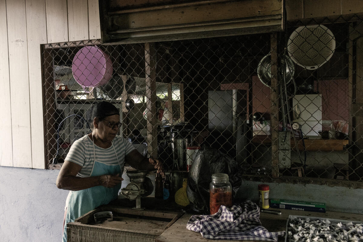 Vicenta, hard at work in the kitchen of her farmhouse, checks on a batch of handmade chocolates.