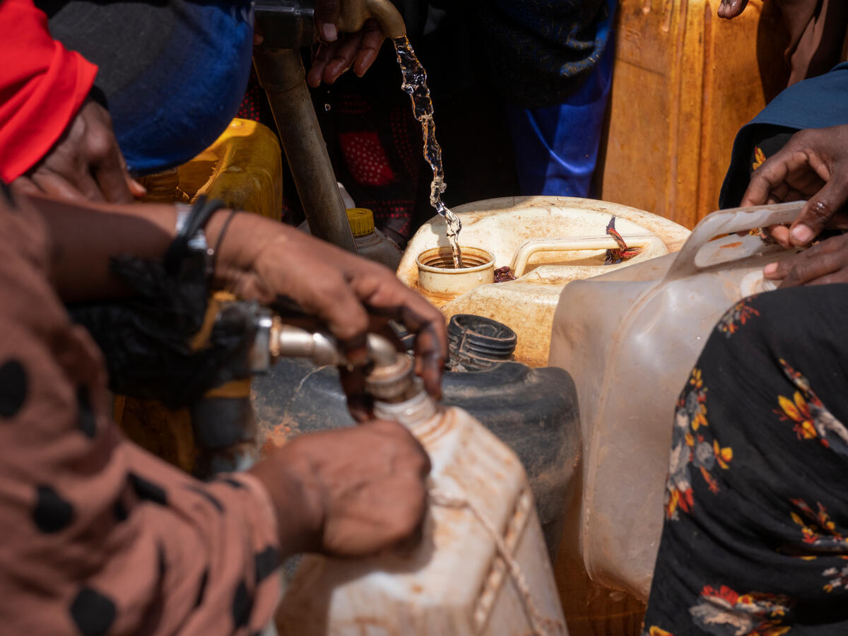 Somalia. Internally displaced Somalis queueing to fill their jerry cans with water